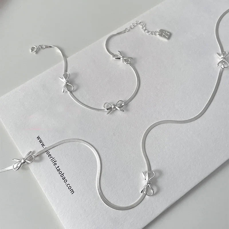Collar y brazalete femenino de espiral de arco